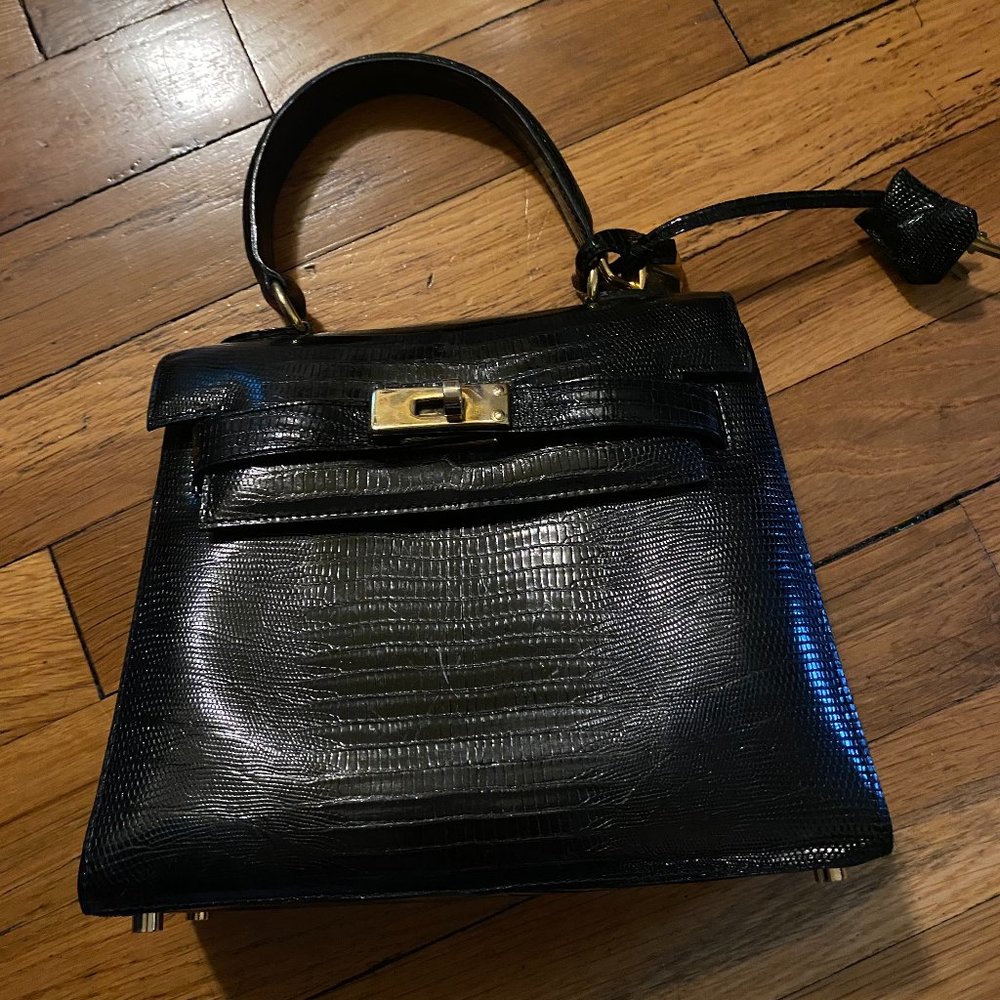 Lionhart black genuine lizard with gold lock hardware handbag